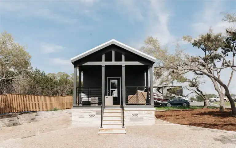 Modern tiny house with porch at Horseshoe Ridge RV resort in Georgia.