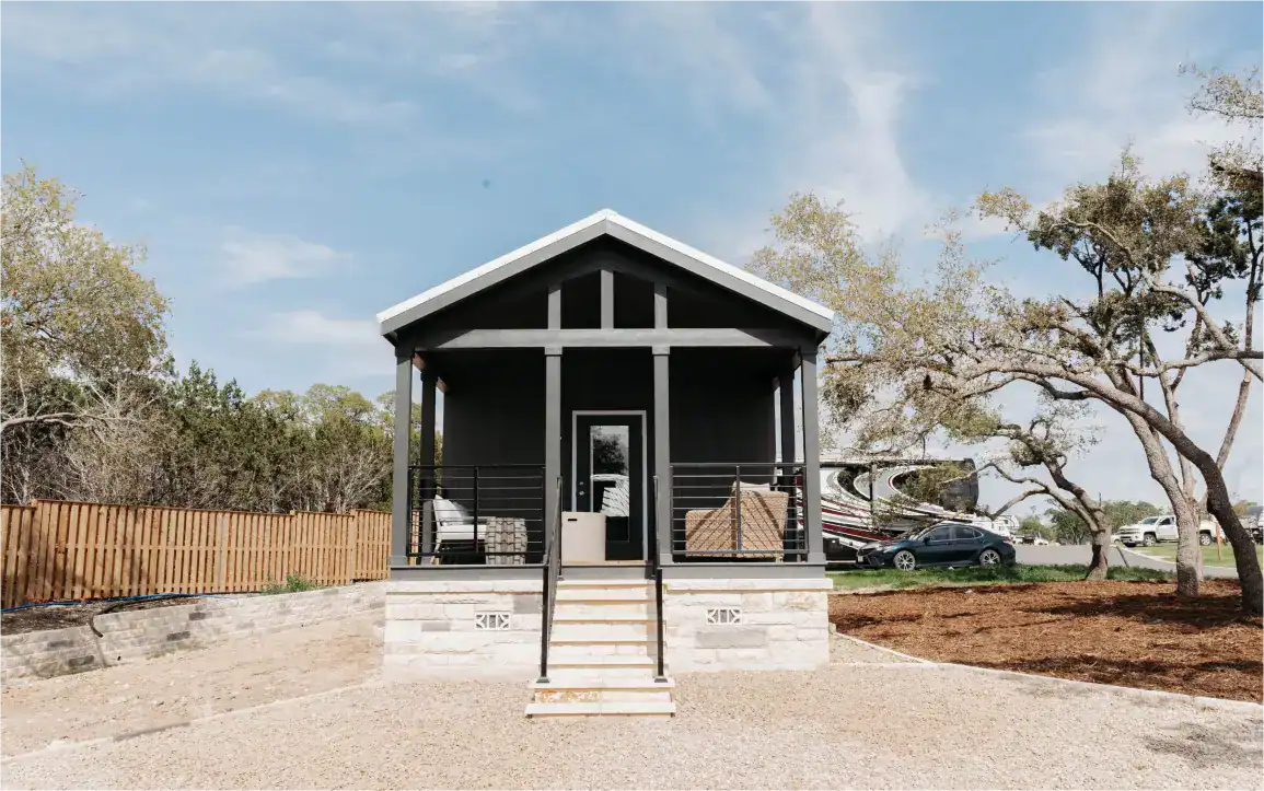 Modern tiny house with porch at Horseshoe Ridge RV resort in Georgia.