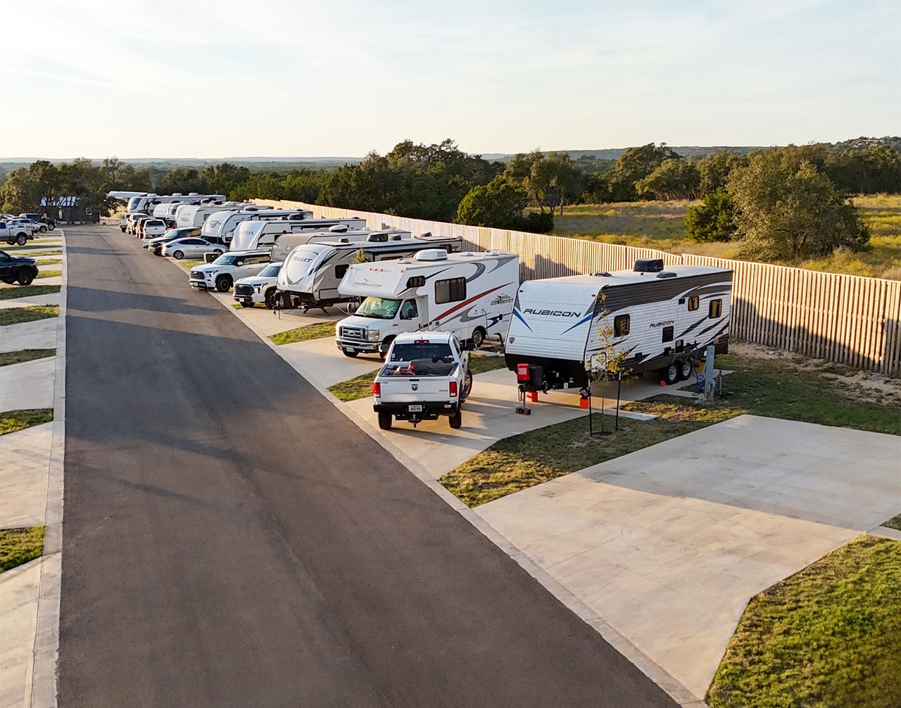 exterior view of luxury RV site amongst trees and grass
