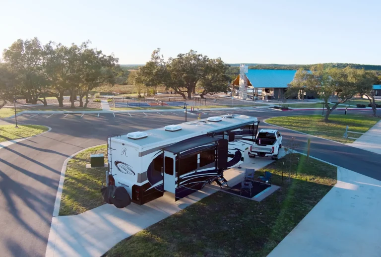 exterior view of RV site amongst trees and grass