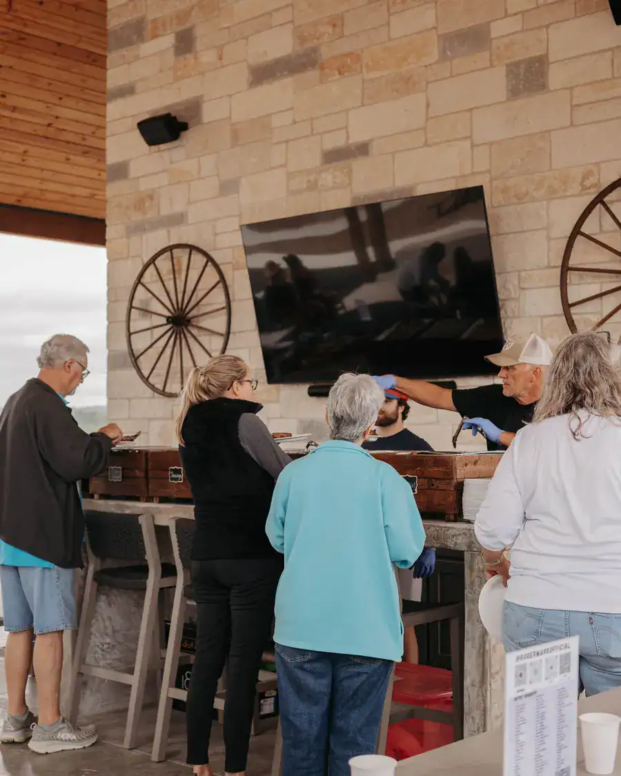 Guests serving themselves at the pavilion kitchen bar