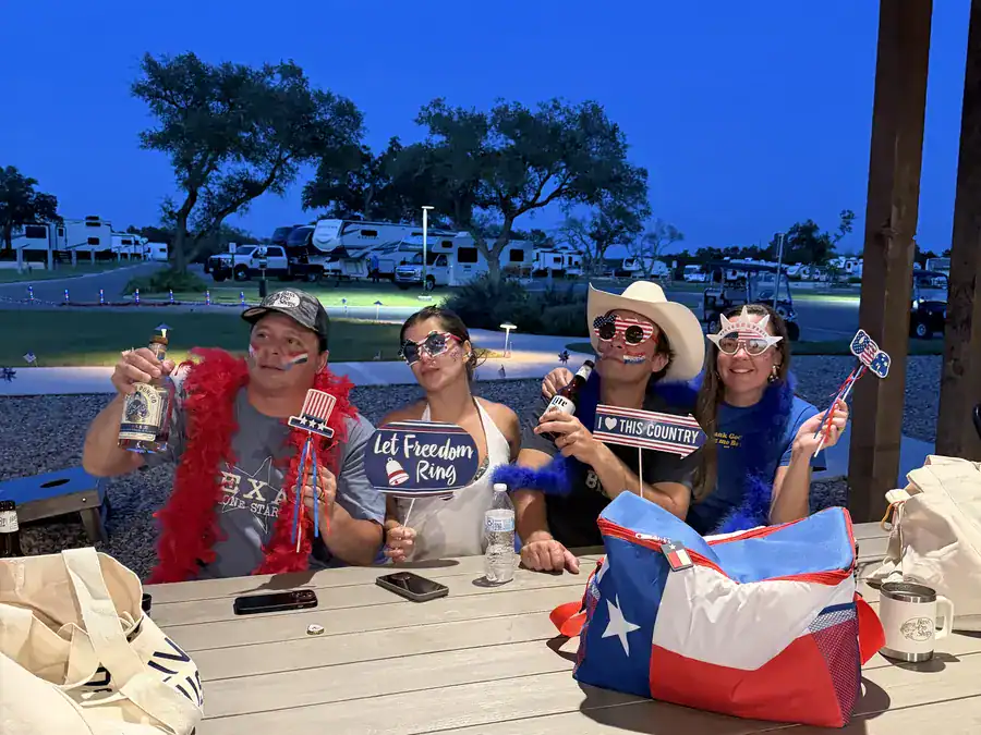 Guests celebrating the Fourth of July at the pavilion at dusk