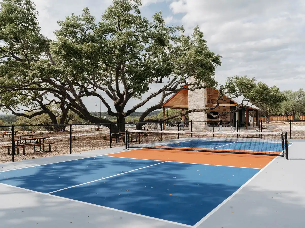 Pickleball court under an oak at Horseshoe Ridge RV Resort