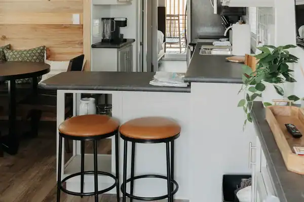 Orange leather bar stools at the breakfast bar in The Mingo