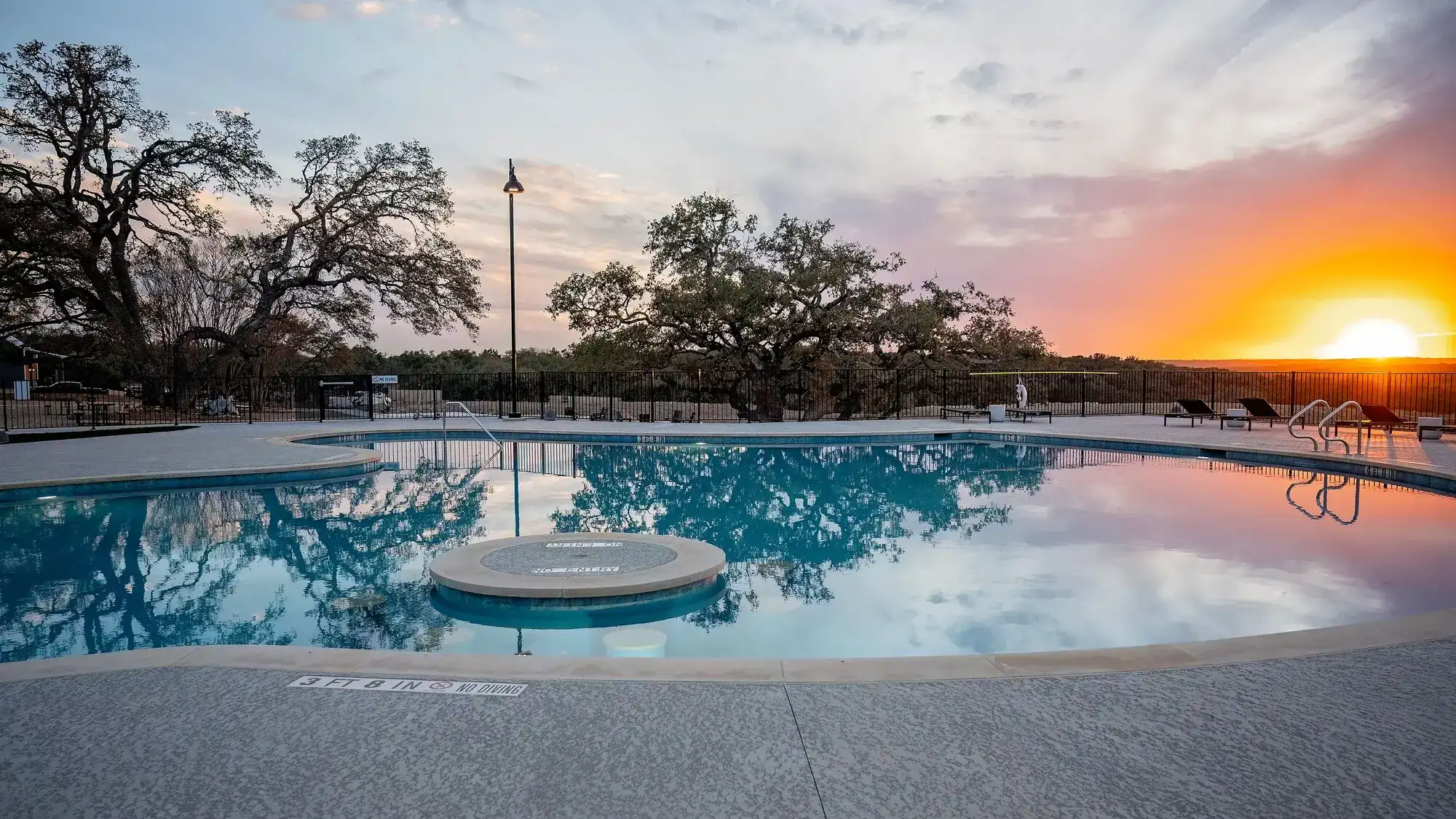 Sunset over the resort pool at Horseshoe Ridge RV Resort