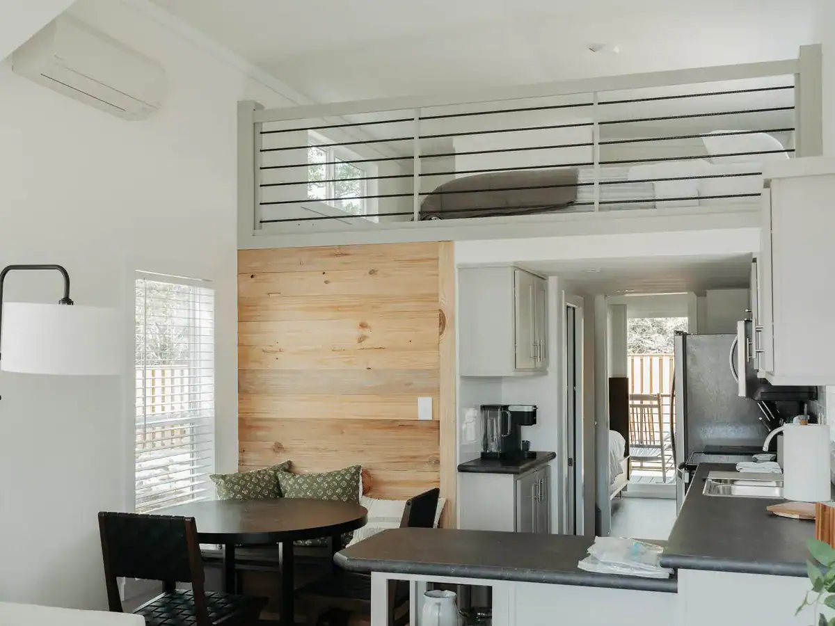 The Mingo cabin with a sleeping loft above the kitchen and dining nook