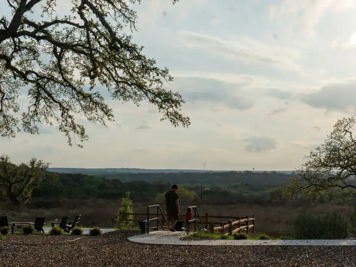 A long Hill Country view framed by oaks near Wimberley