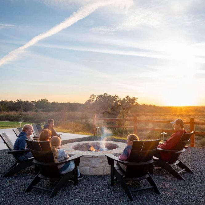 Relaxing outdoor fire pit area at Horseshoe Ridge RV during sunset.
