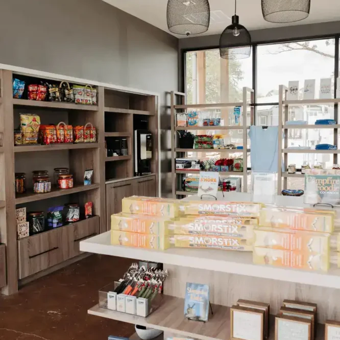 Interior view of Horseshoe Ridge RV store with snacks and souvenirs on display.