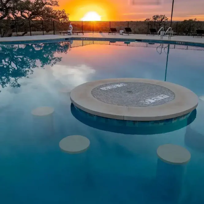 Relaxing pool at Horseshoe Ridge RV with sunset view and scenic surroundings.